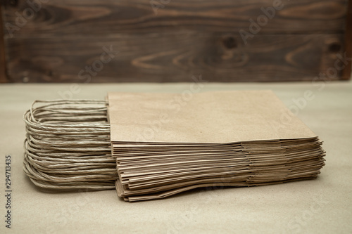 a stack of craft packages on the table. ecologically pure. place for text. Many craft packages close up. Business concept