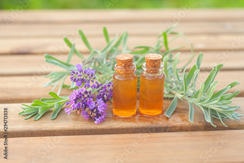 lavender essential oil in  beautiful bottle on table