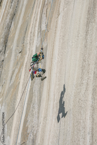Adaptive climber pulling up on el Capitan photo