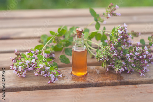 Essence of lavender flowers on table in beautiful glass Bottle