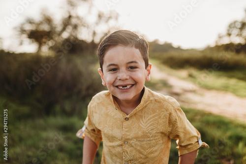 Portrait of young school-aged boy missing two front teeth