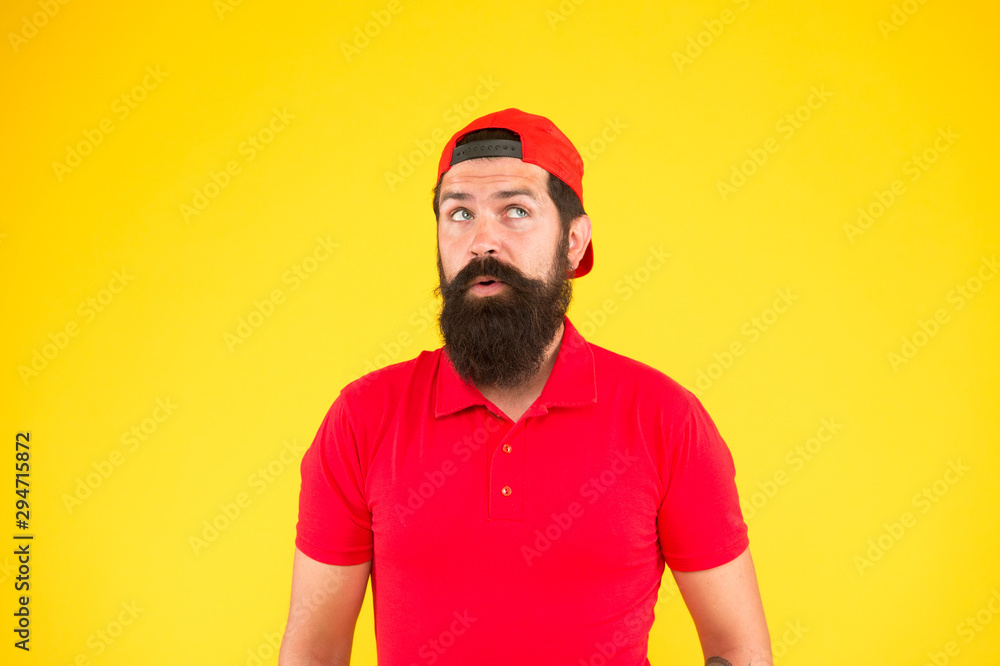 Give me a second. Supermarket staff wanted. Man bearded hipster with mustache wear uniform yellow background. Shop staff concept. Salesman career. Hiring shop store worker. Hospitality staff