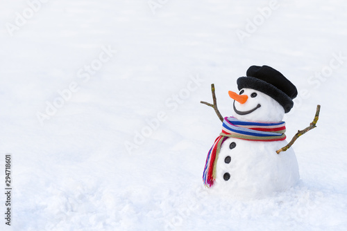 Obraz na plátně Cute snowman in deep snow