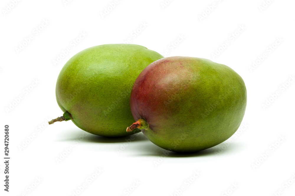 Mango, two whole ripe exotic tropical fruits isolated on white background, healthy food, diet and vegetarian nutrition Mango, two whole ripe exotic tropical fruits isolated on white background, healthy food, diet and vegetarian nutrition
