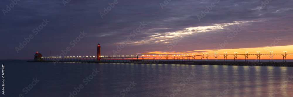 lighthouse and pier at sunset lighthouse and pier at sunset