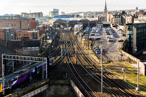 Wide angle view of Newcastle Central railway and multiple tracks and points as a train is leaving the station photo