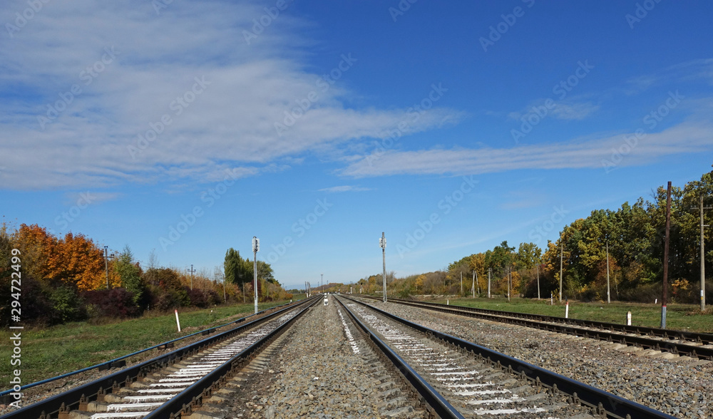 Railroad tracks on a clear autumn day