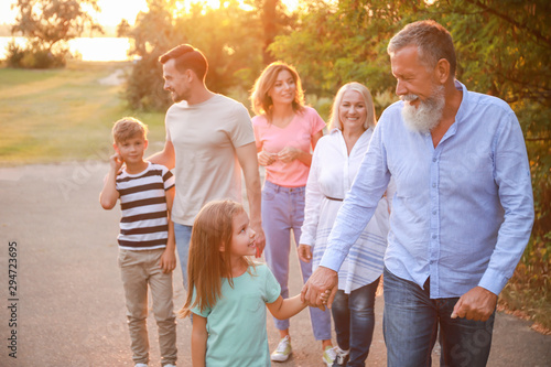 Big family walking in park