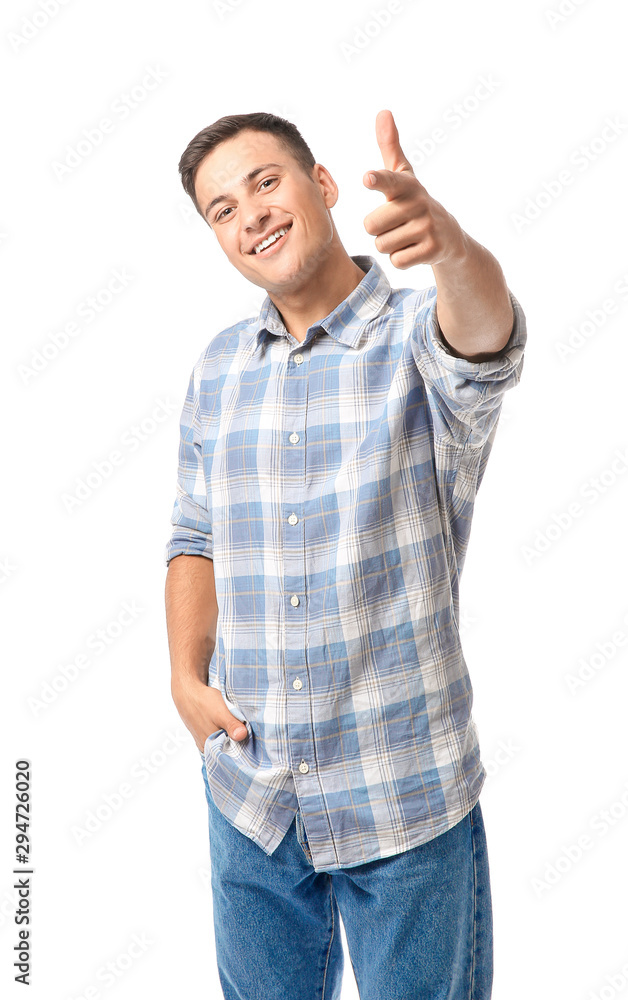Portrait of handsome young man pointing at viewer on white background Portrait of handsome young man pointing at viewer on white background