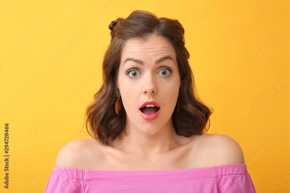 Surprised young woman on color background Surprised young woman on color background