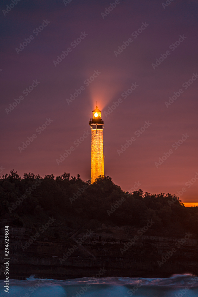 Biarritz lighthouse in a beautiful sunset. France, vertical photo