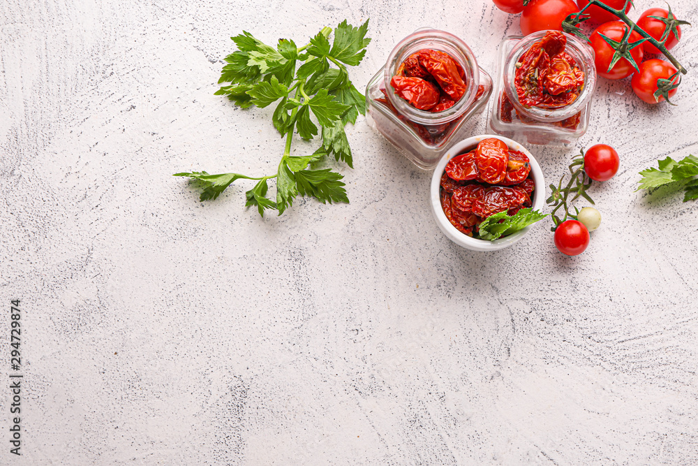 Composition with tomatoes and herbs on light table Composition with tomatoes and herbs on light table