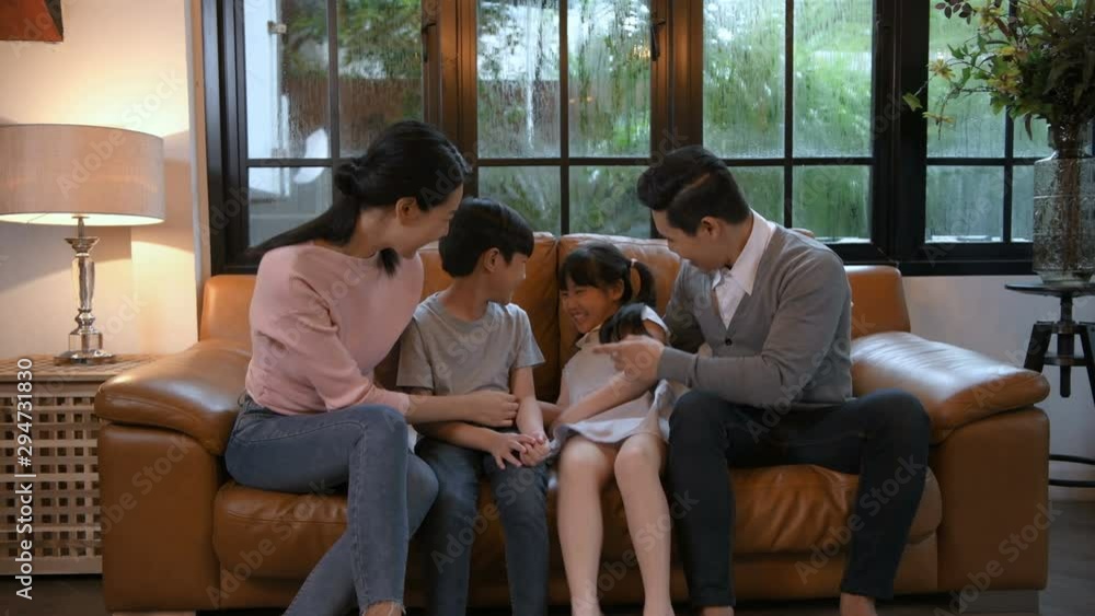 Holiday concept. The family is playing on the sofa in the living room. 4k Resolution. Holiday concept. The family is playing on the sofa in the living room. 4k Resolution.