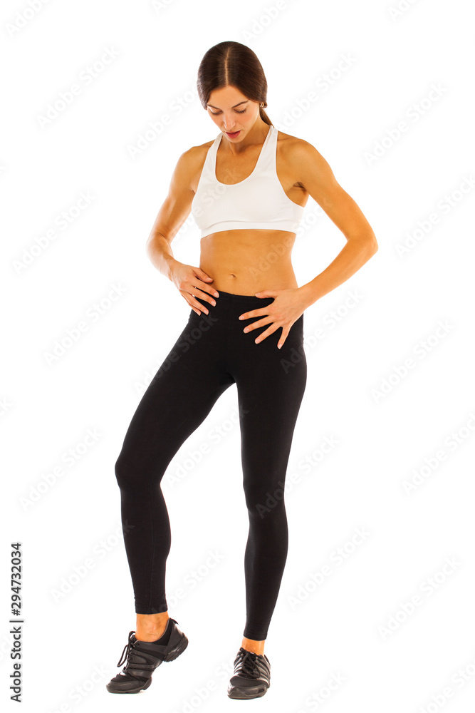 Sexy fitness woman posing in studio - isolated on a white background Sexy fitness woman posing in studio - isolated on a white background