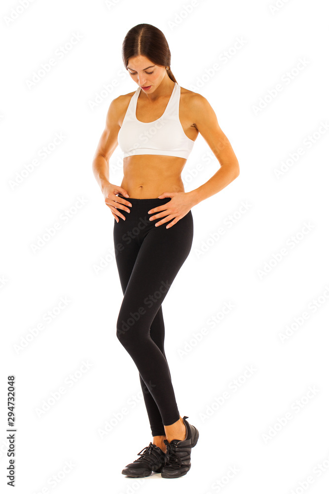 Sexy fitness woman posing in studio - isolated on a white background Sexy fitness woman posing in studio - isolated on a white background
