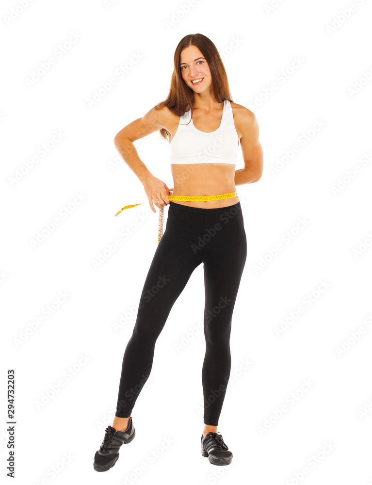 Sexy fitness woman posing in studio - isolated on a white background Sexy fitness woman posing in studio - isolated on a white background