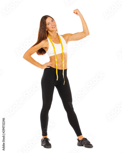 Sexy fitness woman posing in studio - isolated on a white background