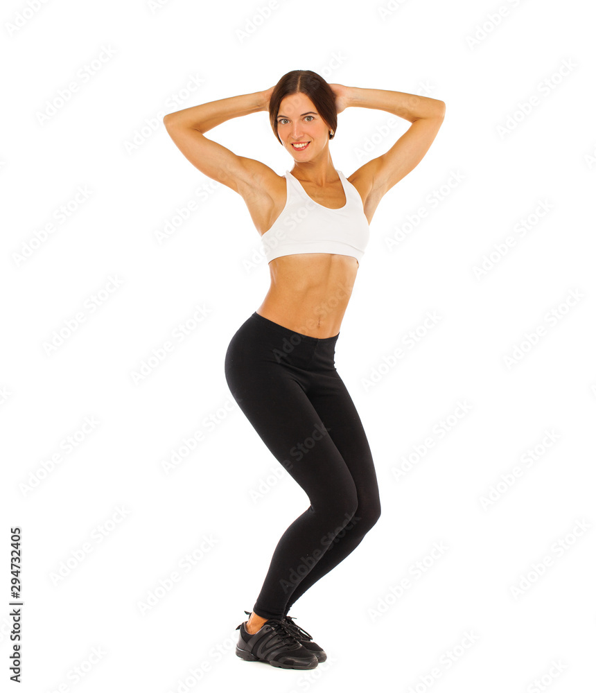 Sexy fitness woman posing in studio - isolated on a white background