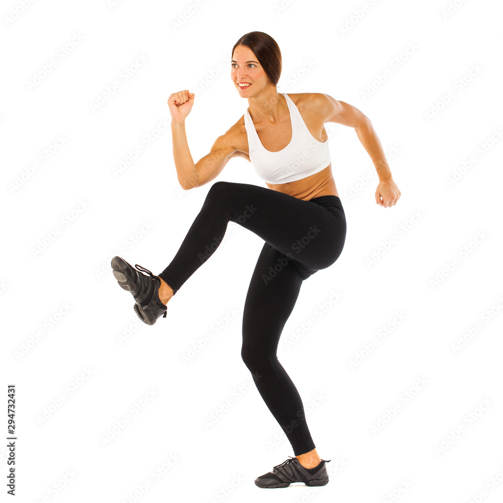 Sexy fitness woman posing in studio - isolated on a white background Sexy fitness woman posing in studio - isolated on a white background