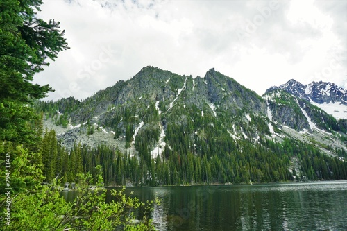 Fototapeta Naklejka Na Ścianę i Meble -  Mountain Water Landscape with Trees and Snow Mount Stuart Washington USA