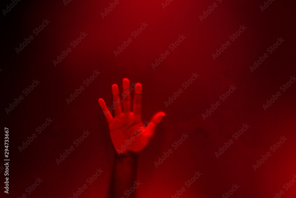 Creepy hand behind the frosted glass. Creepy hand behind the frosted glass.