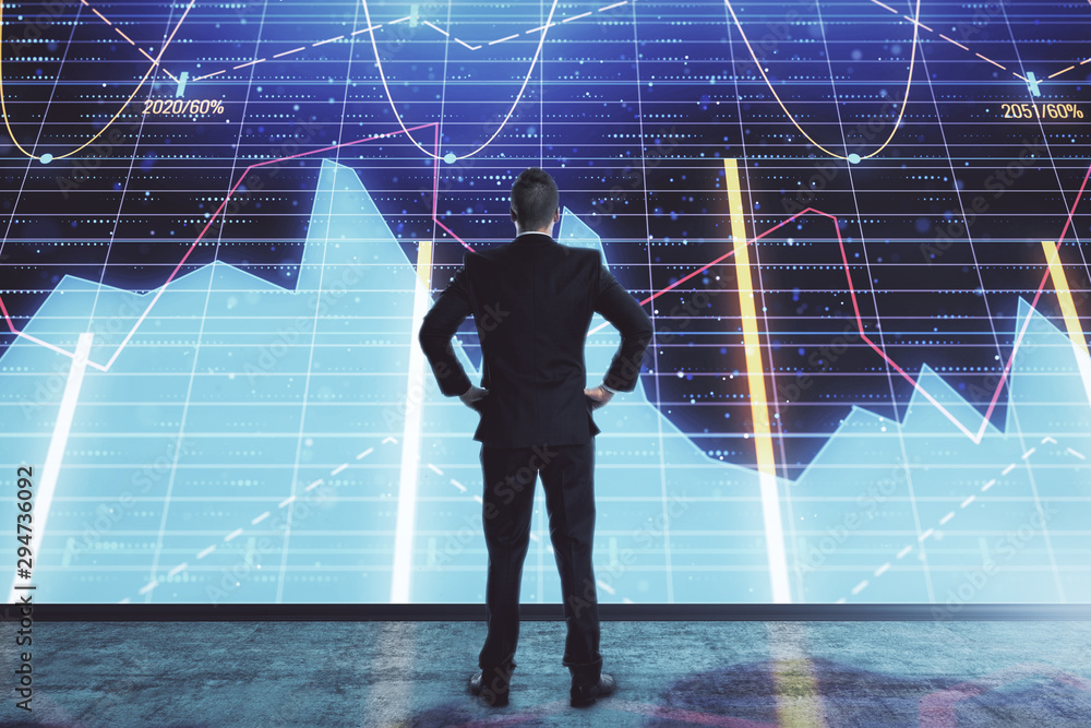 Businessman and forex graph hologram. Double exposure. Concept of financial education and analysis Businessman and forex graph hologram. Double exposure. Concept of financial education and analysis