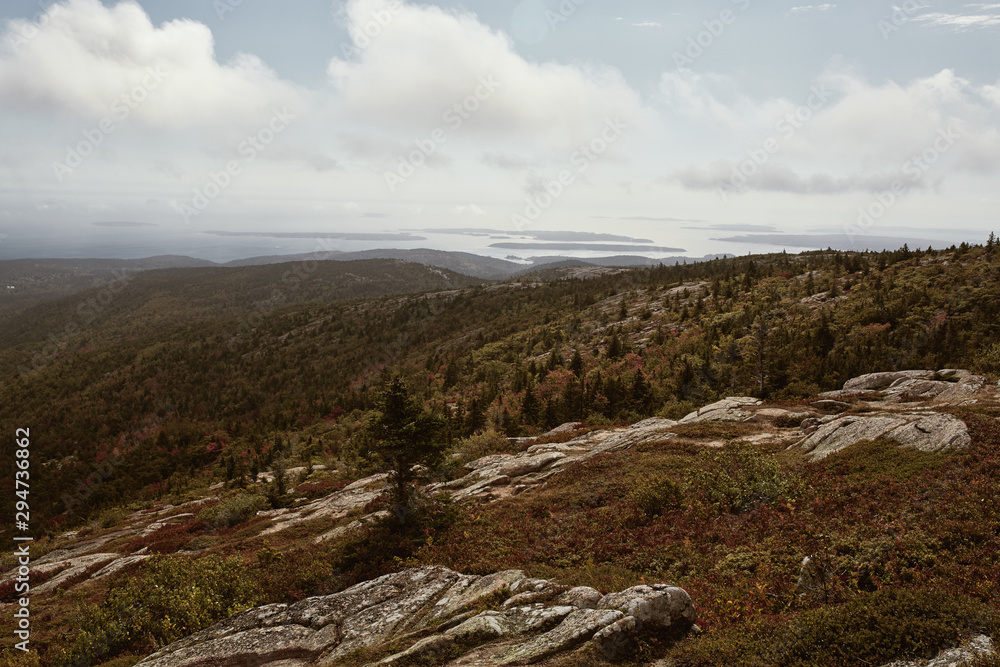 View of Maine coastline in the distance from Cadillac Mountain on Mount Desert Island in Acadia National Park