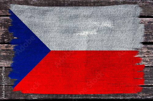photo of the beautiful colored national flag of the modern state of the Czech Republic on textured fabric, concept of tourism, economics and politics, closeup