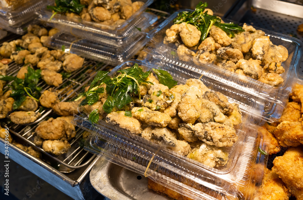 taiwanese fried chicken on a plate in the street