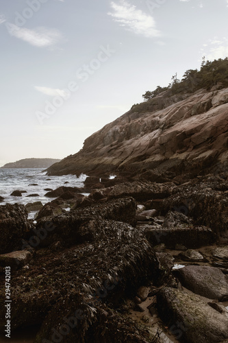 Sunset over rugged coastline of Sand Beach on a cool Fall evening in Acadia National Park on Mount Desert Island, Maine.