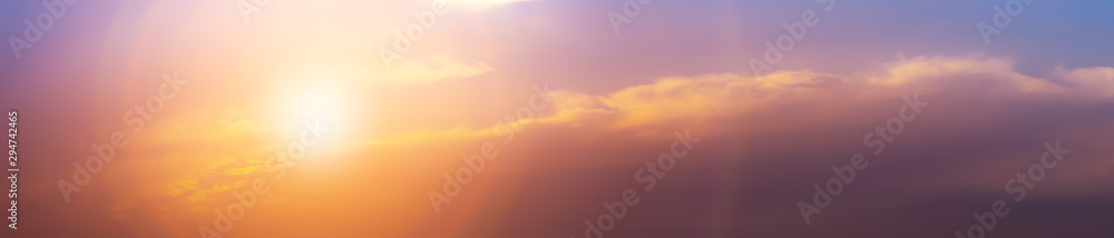 Romantic sky background with sun and clouds