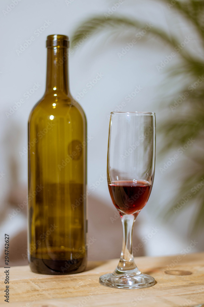 bottle and glass of red wine