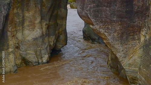 Slow motion video of water flowing in Obluang national park, Thailand. photo