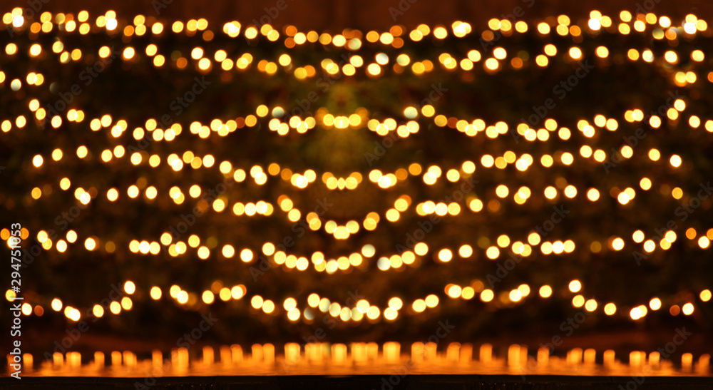 Naklejka premium Bokeh blurred yellow and gold color background.