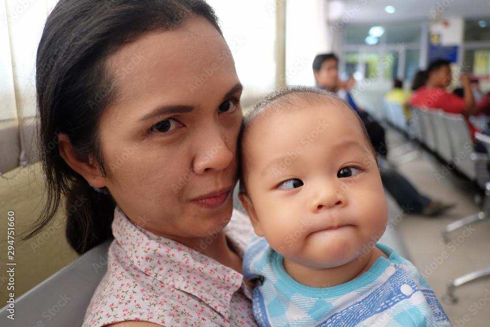 Asian boy with strabismus and mom. Asian boy with strabismus and mom.