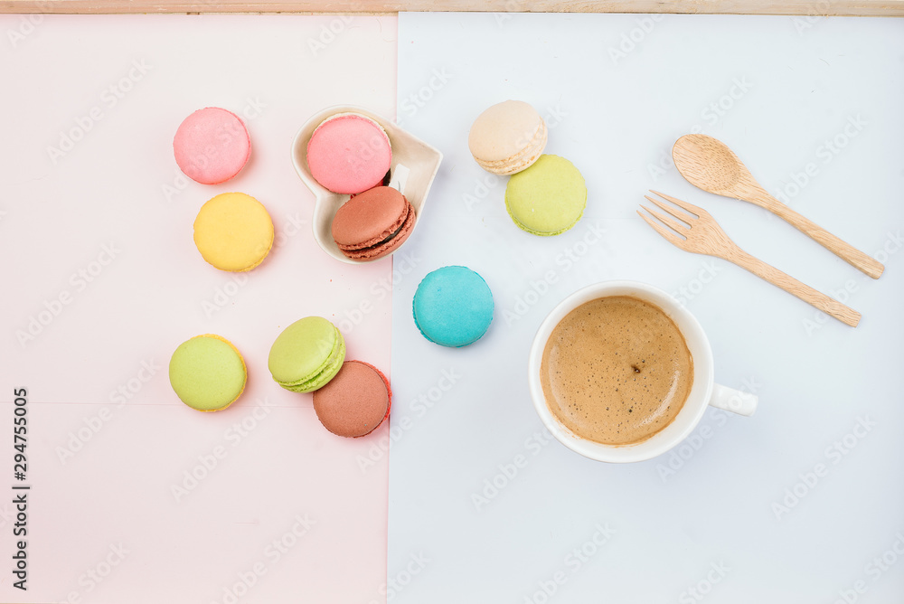 Delicious and colorful macarons placed on a wooden tree decorated with sweet coffee. Delicious and colorful macarons placed on a wooden tree decorated with sweet coffee.