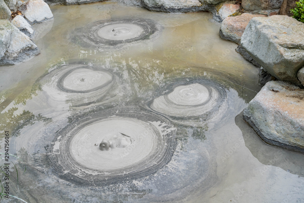 Oniishi bozu jigoku hell Beppu , focus to circle bubbles forming in grey  mud Shaven Monk’s Head Hell hot spring at Beppu, Oita-shi, japan.