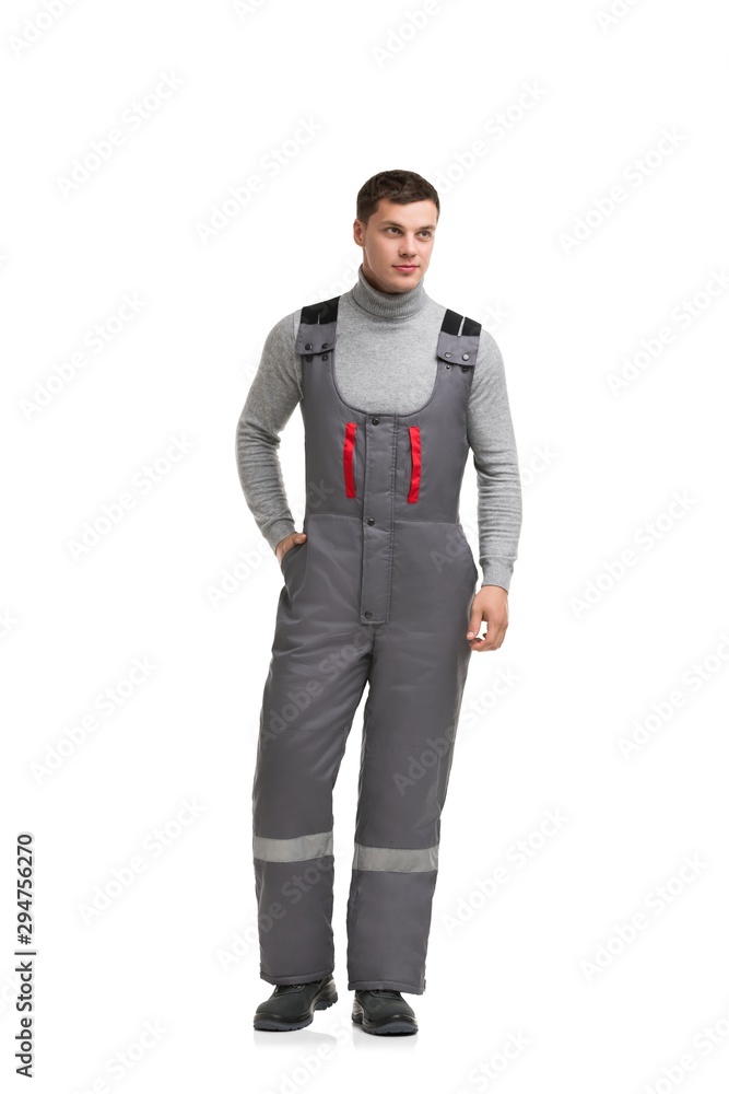 Handsome male in gray work overalls view Handsome male in gray work overalls view