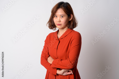 Portrait of angry Asian woman with arms crossed