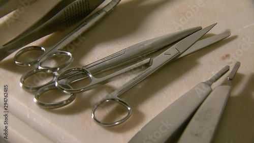 Scissors and embalming tools on a table