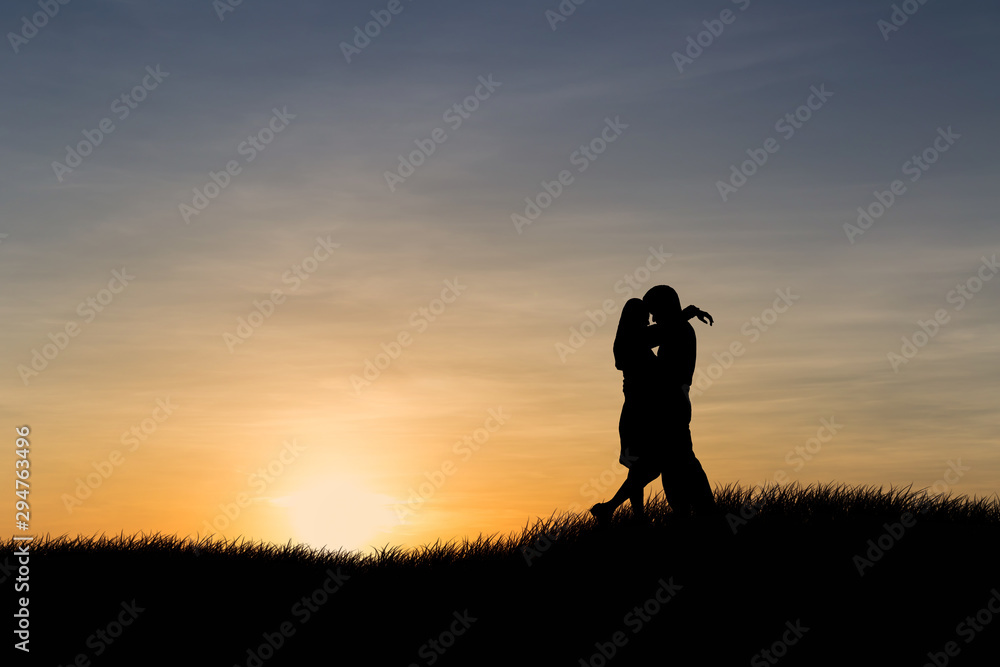 Silhouettes of couple man and woman in nature sunset background. Love concept. Silhouettes of couple man and woman in nature sunset background. Love concept.