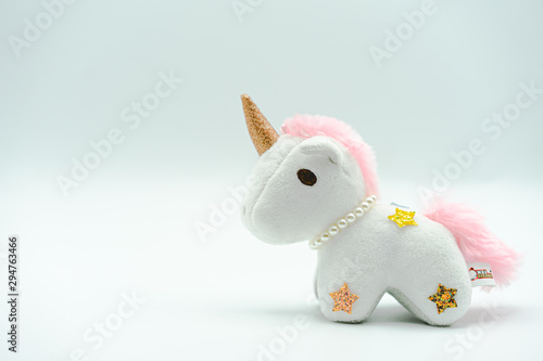 Fluffy unicorn plush kid toy isolated on white