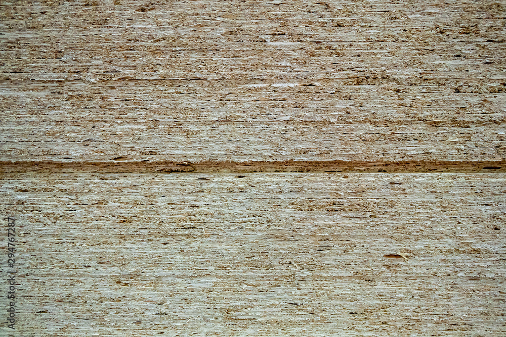 Fototapeta premium A pile of fresh wood plywood sheets. High stack of large plywood sheets