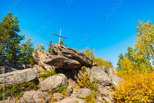 Cross at the top of the cliff on Mount Tserkovka resort Belokurikha in Altai Krai photo