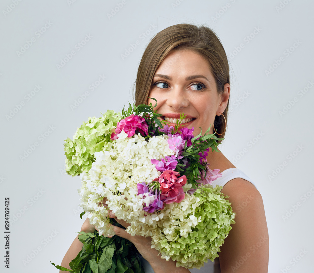 Beautiful smiling girl holding flowers. Beautiful smiling girl holding flowers.