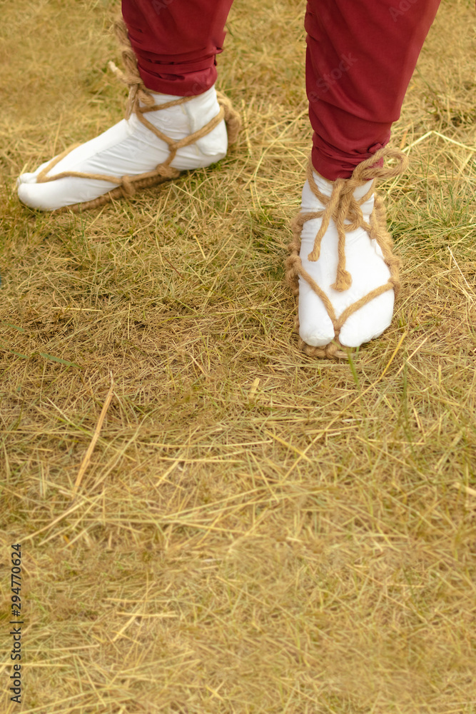 Samarai varaja sandals made of straw rope. Traditional Japanese shoes on  the foot. Photos | Adobe Stock