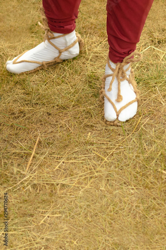 Samarai varaja sandals made of straw rope. Traditional Japanese shoes on the foot. photo