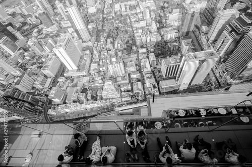 Bangkok  Thailand - September 27 2019  Top view group of people lined up and the city top views. Top view from king power mahanakhon observation deck 314 meters the peak glass tray. unemployed.