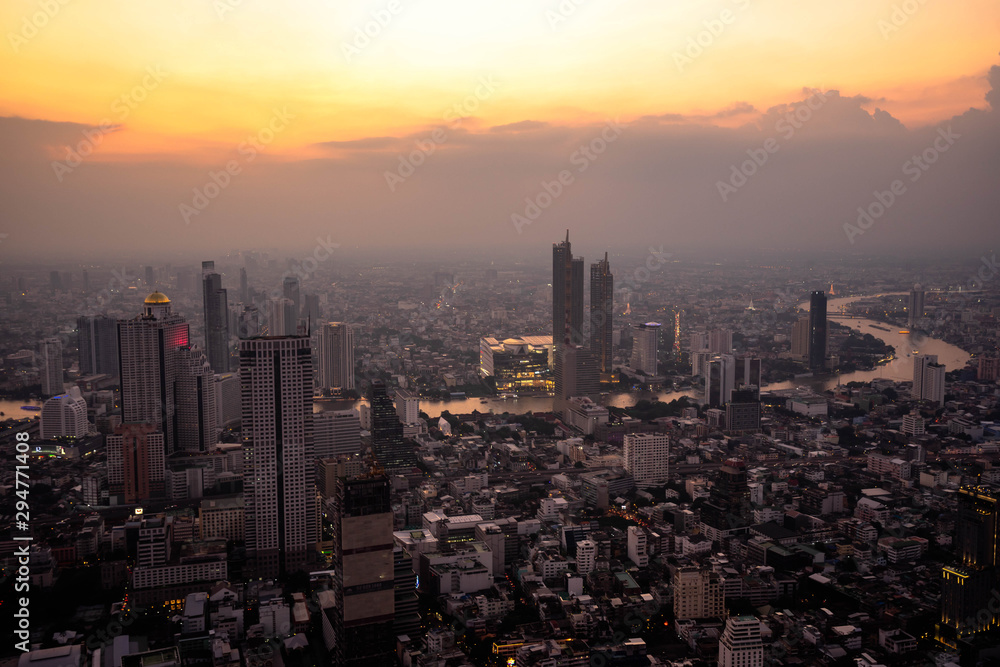 Bangkok, Thailand - September 27 2019: Panoramic view of the Bangkok city Located at the top of King Power Mahanakhon Building with The sky and sun at sunrise nature background.