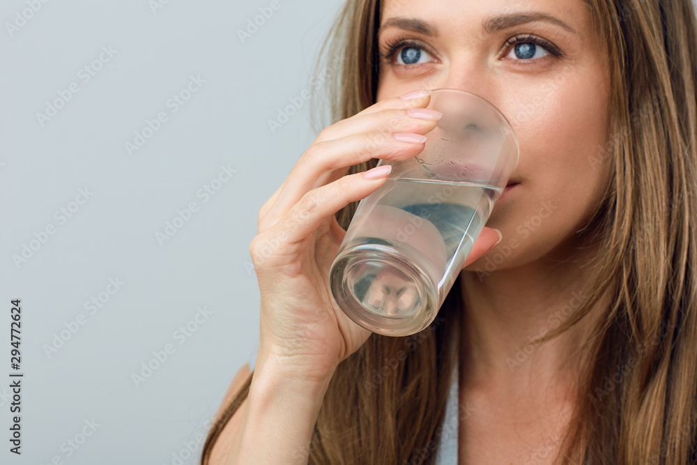 woman drinking water. close up face portrait. woman drinking water. close up face portrait.